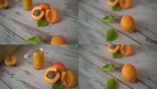 自制的杏酱装在玻璃碗里，放在木桌上高清在线视频素材下载
