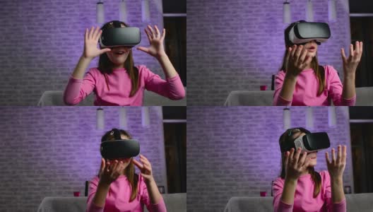 戴着虚拟现实眼镜的小女孩高清在线视频素材下载