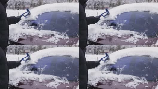 冬天，戴着黑色皮手套的司机用刷子擦车窗上的雪。高清在线视频素材下载