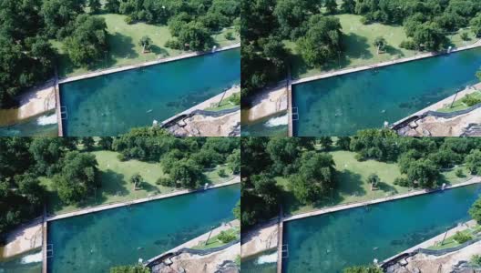 美国德克萨斯州奥斯汀的巴顿斯普林斯天然游泳池的侧面潘在南奥斯汀高清在线视频素材下载