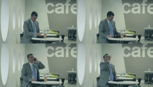 商务主管在café进行电话工作高清在线视频素材下载