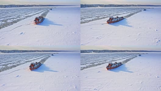 冬天的破冰船。冰冻河流的鸟瞰图。高清在线视频素材下载