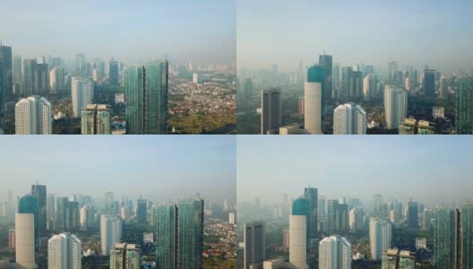 雾霾清晨摩天大楼的航拍画面高清在线视频素材下载