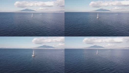 帆船，后面是维苏威火山高清在线视频素材下载