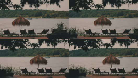 湖边有躺椅和遮阳伞高清在线视频素材下载