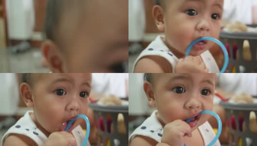 宝宝用嘴玩塑料玩具高清在线视频素材下载