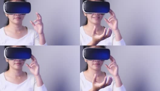 年轻女子在Metaverse体验VR时使用虚拟现实耳机触摸空气。VR(虚拟现实)，技术，视频游戏和元世界概念。高清在线视频素材下载