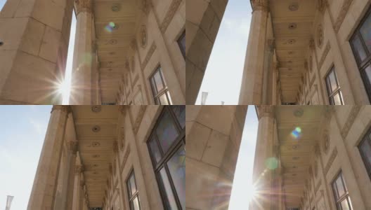 有柱子的漂亮建筑。明亮的阳光照进照相机。缓慢的运动。乌克兰，基辅。07 11 18公园VDNH高清在线视频素材下载