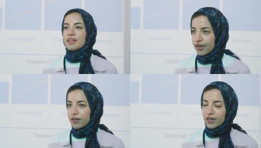 中东妇女带着头巾在商务会议上做报告高清在线视频素材下载