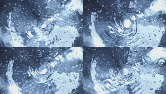 旋转水通过带有气泡的漩涡而旋转拍摄是慢动作1000帧/秒。高清在线视频素材下载