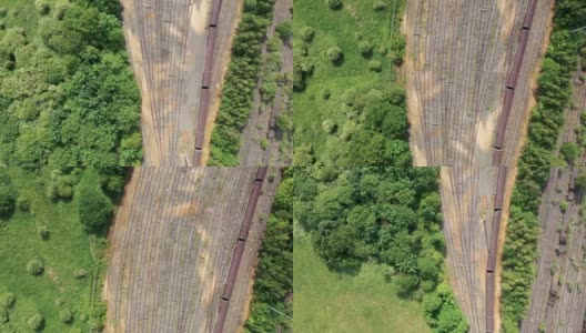 在英国西约克郡利兹的奥斯蒙德索普村，一架无人机拍摄到了夏季的火车站和铁轨，铁轨上有很多火车高清在线视频素材下载