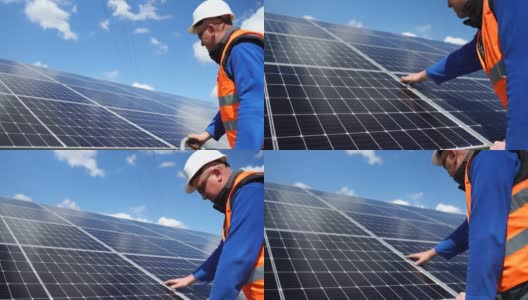 太阳能发电厂的工作人员正在对太阳能电池板进行目视检查。可再生能源的概念高清在线视频素材下载