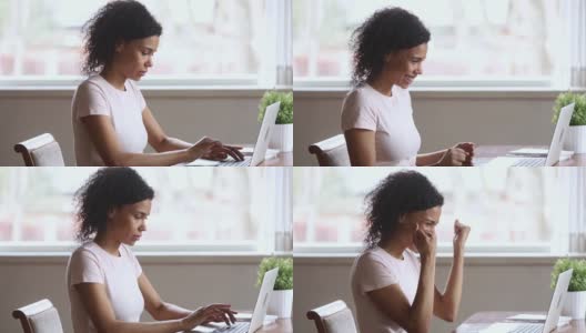 非洲女学生看笔记本电脑时喜出望外高清在线视频素材下载