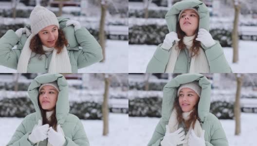 年轻女子在寒冷的雪天穿着暖和的衣服高清在线视频素材下载