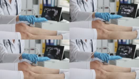 戴着橡胶手套的医生用超声波机扫描病人的腿高清在线视频素材下载