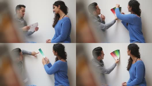 年轻夫妇选择油漆颜色样本高清在线视频素材下载
