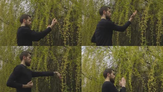 一个年轻人在森林里练习咏春拳高清在线视频素材下载