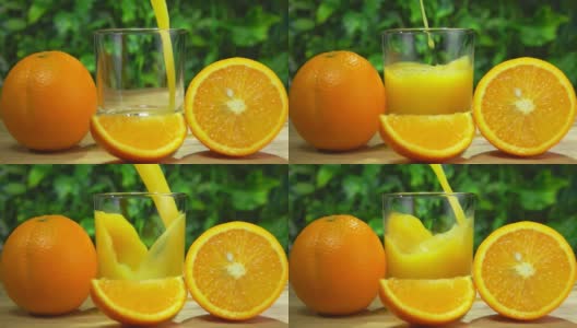 新鲜甜橙汁倒在一个玻璃杯里，旁边是成熟的大桔子高清在线视频素材下载