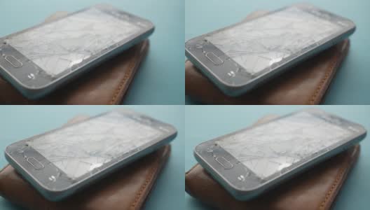 顶部视图的破碎的智能手机的颜色背景高清在线视频素材下载