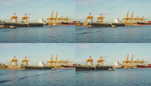一艘船在泰国曼谷的湄南河上行驶，经过主要的孔东湾港口。高清在线视频素材下载