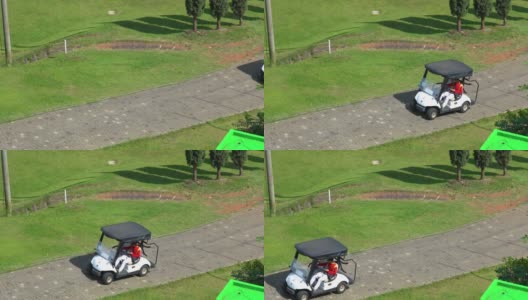 男子驾驶高尔夫球车的鸟瞰图高清在线视频素材下载