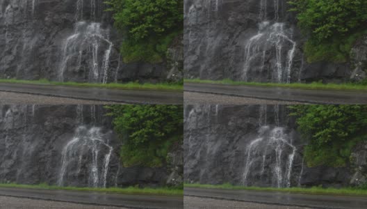 雨从蓝岭公园路的悬崖上落下高清在线视频素材下载