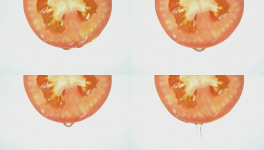 水从西红柿上滴下来。全高清视频高清在线视频素材下载