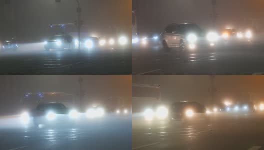 法国斯特拉斯堡——2021年11月6日:雾蒙蒙的秋夜城市，汽车开着前灯和雾灯沿着街道行驶高清在线视频素材下载