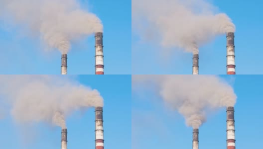 火力发电厂的高管与黑烟向上移动污染大气的特写。以化石燃料的概念生产电能高清在线视频素材下载