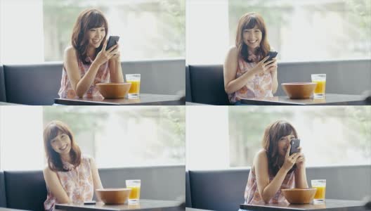 美丽微笑的亚洲女孩使用智能手机并把它放下高清在线视频素材下载