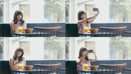 亚洲女孩在咖啡馆自拍高清在线视频素材下载