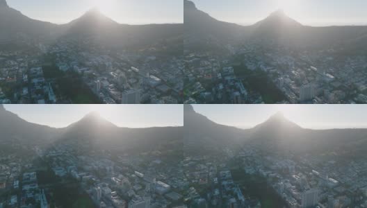 狮子头山下的山坡上，背对着城市发展的阳光。强光限制能见度。南非开普敦高清在线视频素材下载