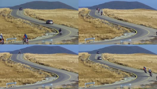 骑自行车的人在一条蜿蜒曲折的道路上骑行高清在线视频素材下载