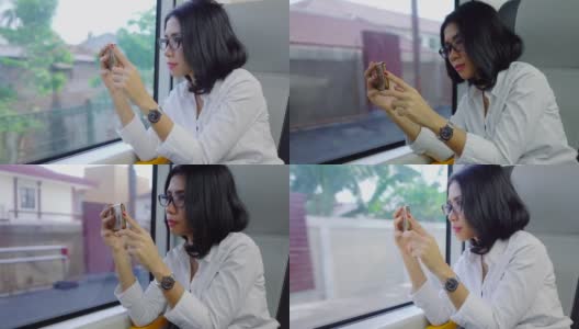 在火车上用手机录像的女人高清在线视频素材下载