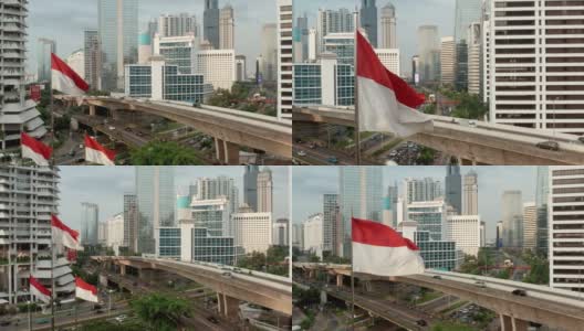 无人机从雅加达市中心的印度尼西亚国旗上拍摄高清在线视频素材下载