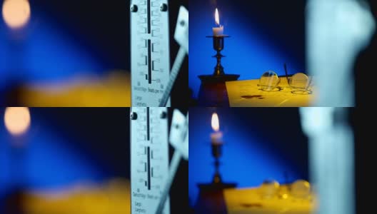 蜡烛手稿和节拍器高清在线视频素材下载
