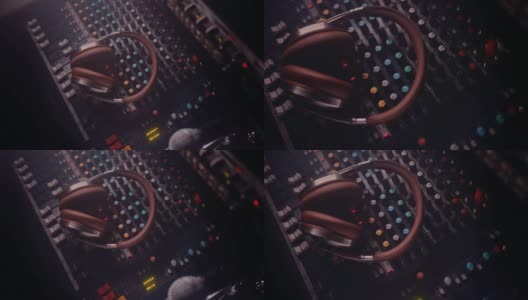 音乐dj工作室混音控制面板上的耳机高清在线视频素材下载