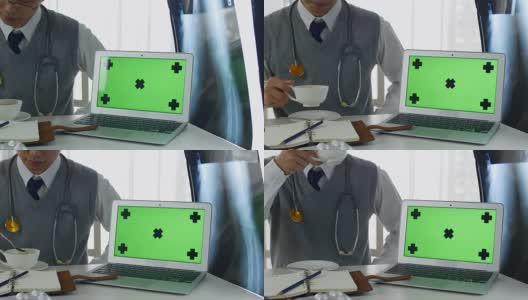 医生与笔记本电脑绿色屏幕高清在线视频素材下载