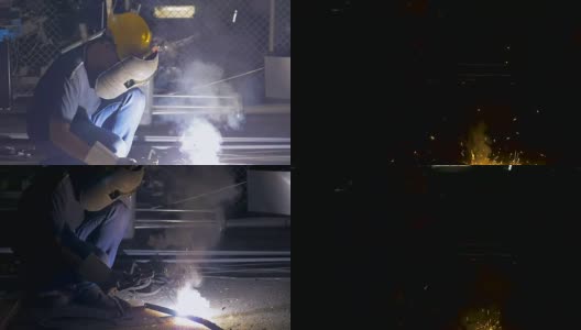工人在工业工厂用火花焊接钢结构高清在线视频素材下载