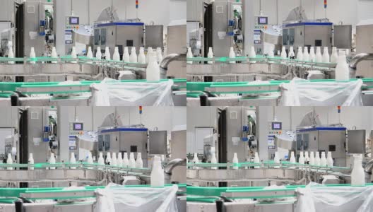 牛奶公司生产线上牛奶瓶的镜头高清在线视频素材下载
