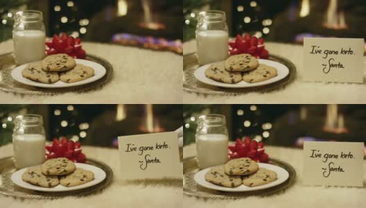 生酮圣诞:圣诞老人在壁炉前放了一张“我生酮了”的纸条，礼貌地拒绝了牛奶和饼干高清在线视频素材下载