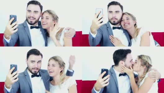 年轻的恋人结婚夫妇在婚纱做自拍和视频通话在一起高清在线视频素材下载