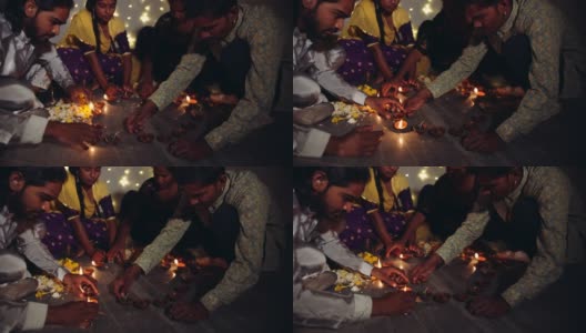 朋友和家人在为印度排灯节做装饰高清在线视频素材下载