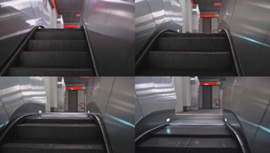 带楼梯的地下电梯上行隔离线。向上看，可以看到地铁站内部。地铁电动移动楼梯高清在线视频素材下载