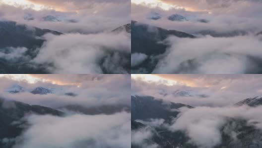 日落时分，新下了雪的群山中弥漫着雾气高清在线视频素材下载