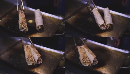 烤沙瓦马烤肉的过程高清在线视频素材下载