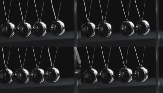 视频悬挂牛顿球的运动在黑色的背景高清在线视频素材下载