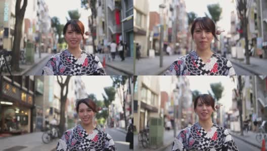 一名日本女子在街上拍视频高清在线视频素材下载