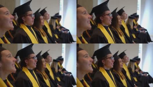 骄傲的大学生们在毕业典礼上兴奋地聆听着主讲人高清在线视频素材下载