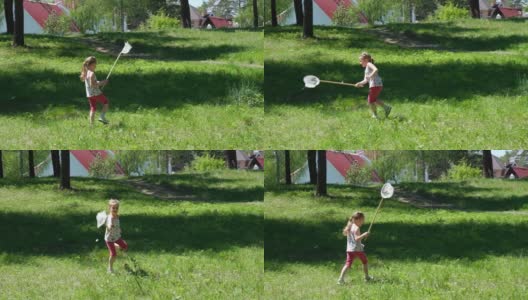 在阳光明媚的夏日里，可爱的小女孩一边走一边用勺子网捉蝴蝶高清在线视频素材下载